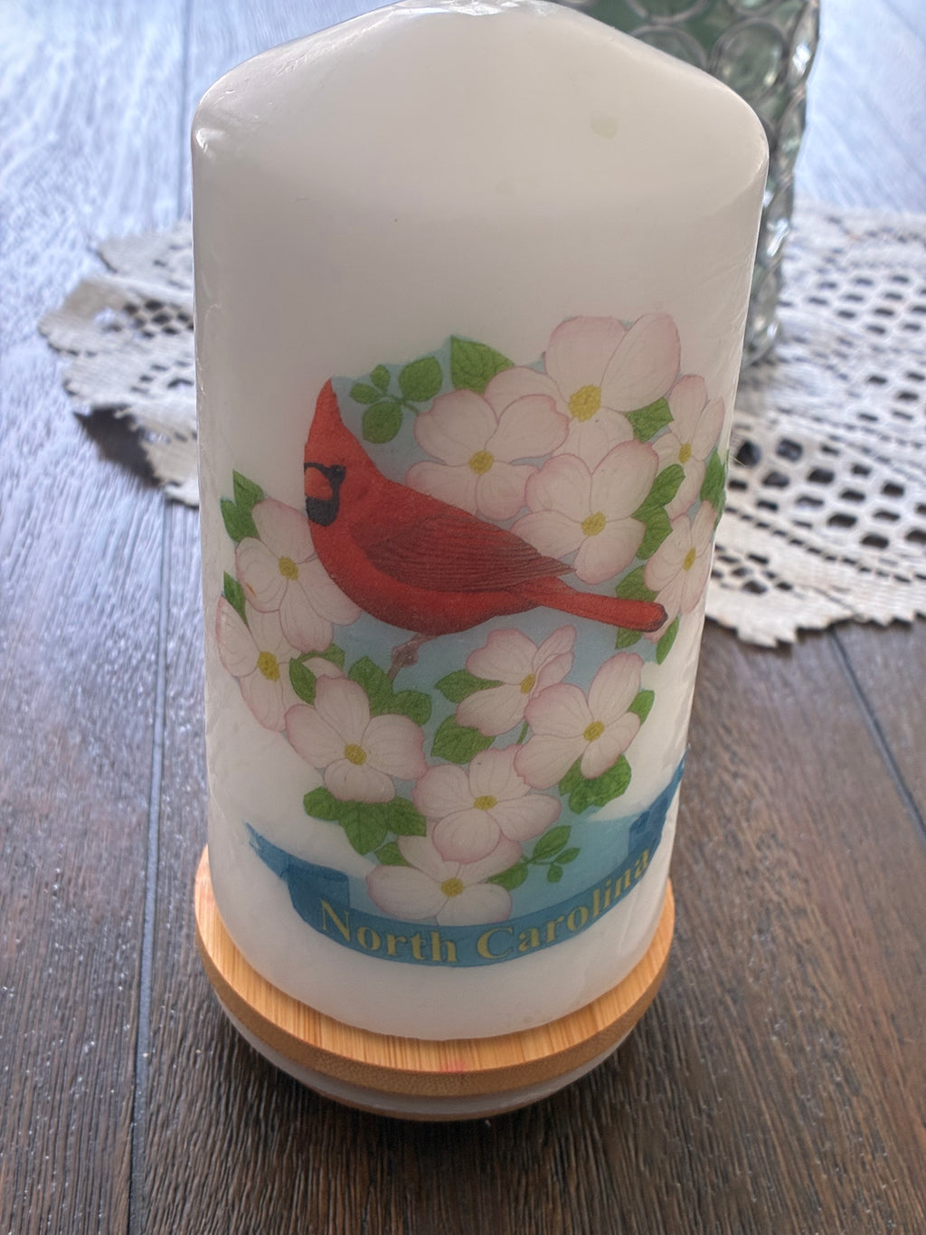 North Carolina Birds and Blooms Pillar Candle with cardinal and dogwood design on bamboo base